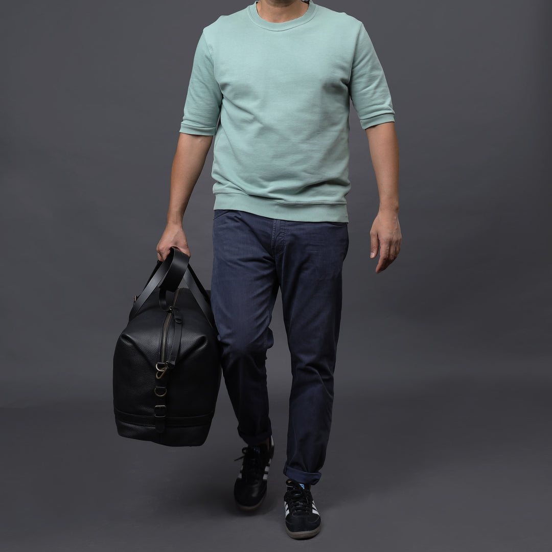 black leather travel handbag