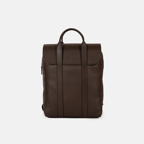 Chief backpack in brown full-grain leather, seen from the front with the flap closed