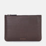 Form storage case in brown full-grain leather, zipped shut