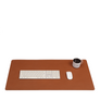 Desk mat in tan leather with a keyboard, mouse and mug on top