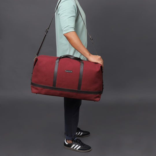 maroon canvas travel handbag