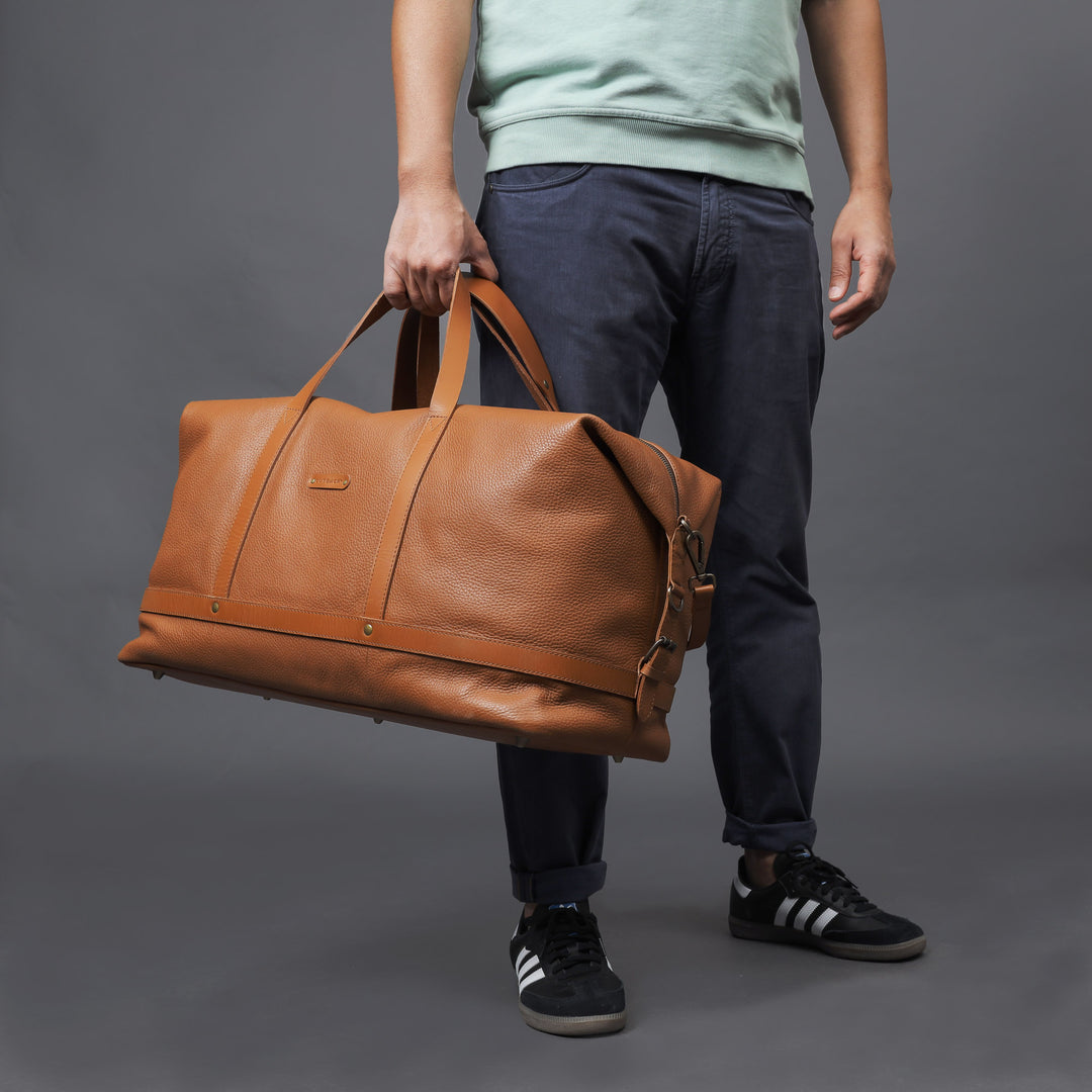 Tan leather travel handbag